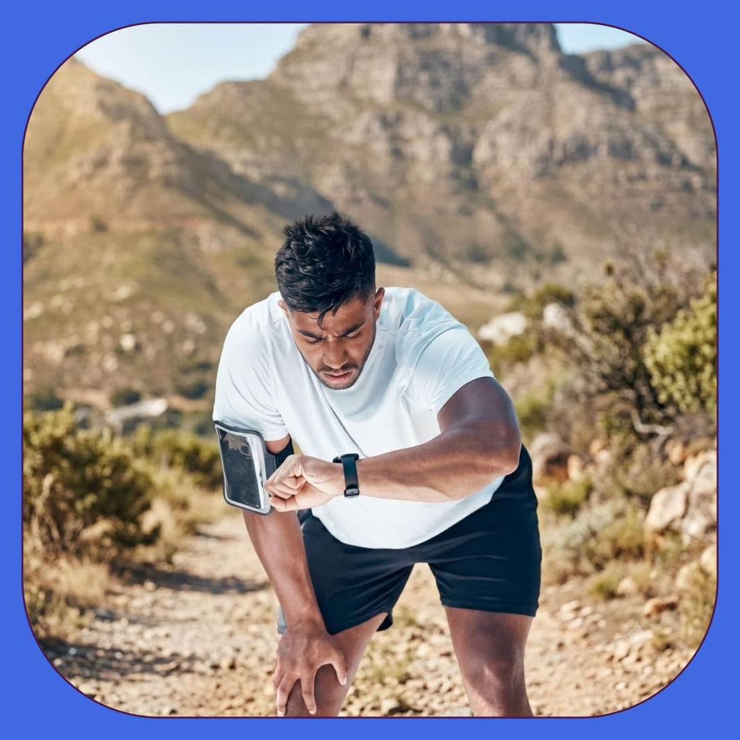 Man checking fitness smartwatch before starting daily cardio workout outdoors.